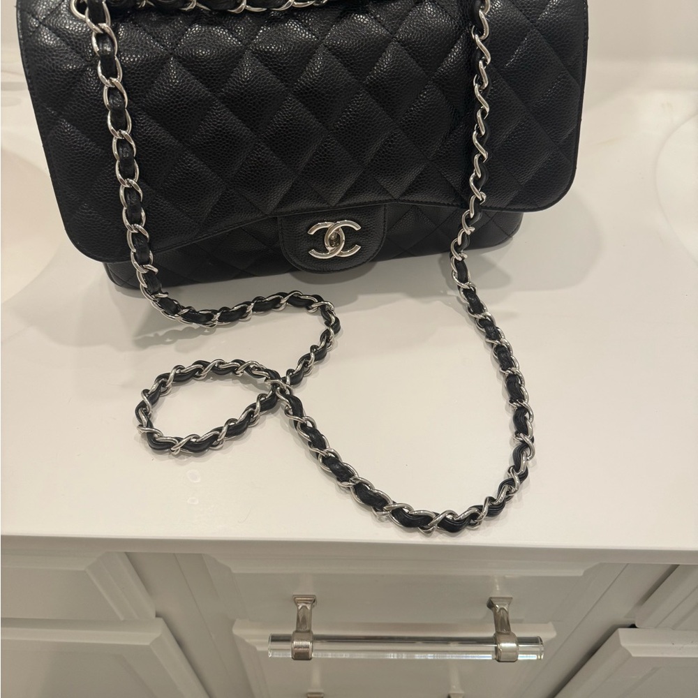 Chanel Black Quilted Shoulder Bag with Iconic CC Closure Silver hardware - Picture 15 of 16